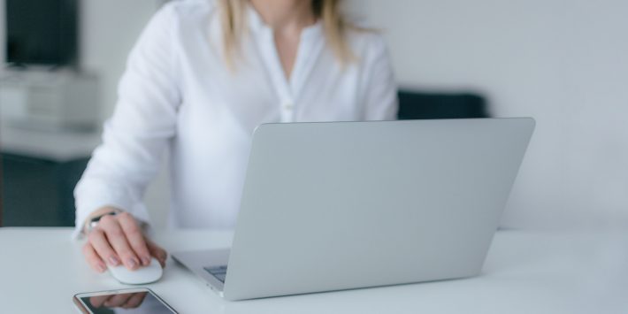 woman-using-silver-laptop-2265488