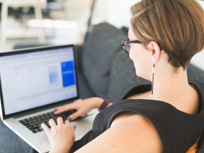 woman-working-on-office-sofa